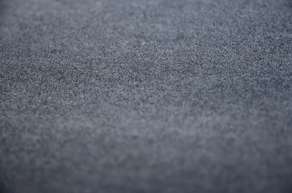 Close-up of a charcoal grey carpet surface