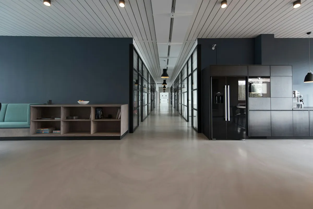 Open office floor with a smooth, hard-wearing grey finish