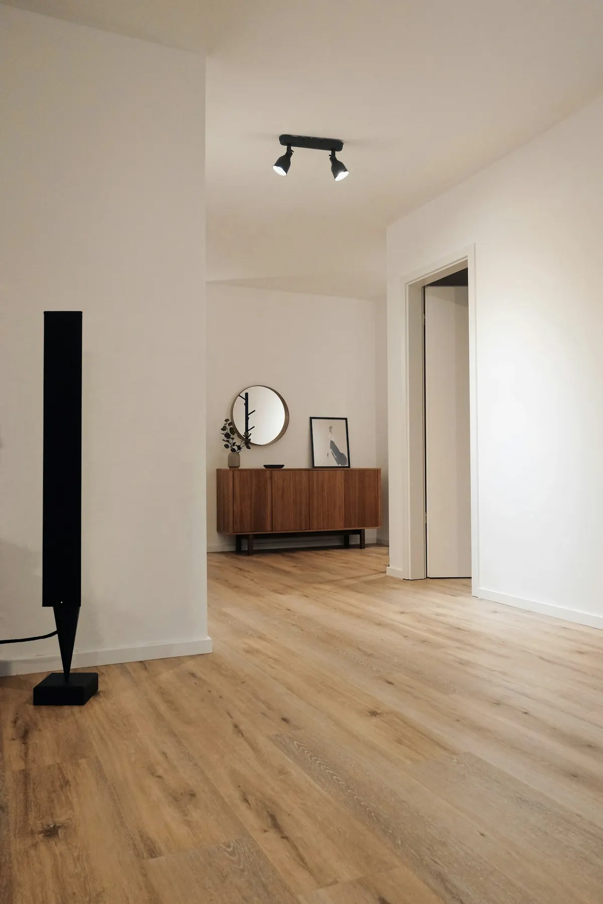 Bright hallway and living area finished in natural oak engineered wood boards